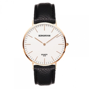 Detail of minimalist quartz watch featuring black lychee leather strap and rose gold case