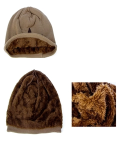 Detail showing the thick faux shearling fleece lining inside the khaki knitted beanie hat