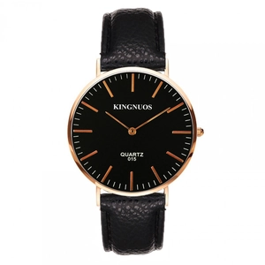 Detail of quartz watch with black litchi leather strap and rose gold case