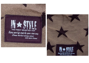 Detailed macro view of the knitted winter hat texture with star pattern and sewn-on label