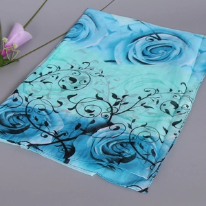 Rectangle chiffon scarf featuring blue rose floral print and mint green gradient pattern