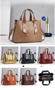 Detailed size chart and internal compartments of faux crocodile leather handbag