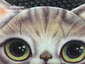 Macro view of realistic tabby cat print on soft plush textile with green eyes