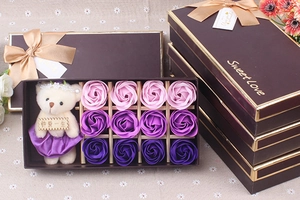 Detail of a purple soap rose gift box with a teddy bear and Sweet Love branding