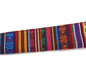 Detailed close-up of woven ethnic shoulder strap with colorful geometric patterns
