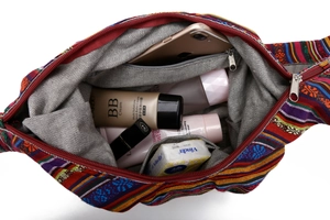 Top view of ethnic bucket bag showing spacious interior with zipper and red blue stripes