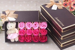 Detail of pink soap roses and a cute plush bear in a Sweet Love gift box for Valentine