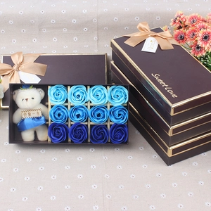 Detailed gift box featuring twelve blue gradient soap roses and a plush teddy bear