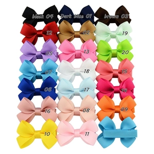 Detailed grid showing 20 colorful grosgrain ribbon bow hair clips for girls
