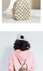Detail of checkered mini backpack with gold swan charm and model wearing back view