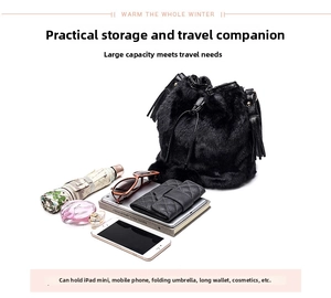Spacious interior of black faux fur bucket bag showing storage for iPad and essentials