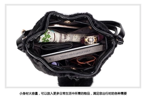 Top view of the black faux fur bag interior showing spacious storage for essentials