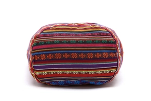 Close-up of vibrant bohemian woven fabric with multicolor ethnic geometric patterns