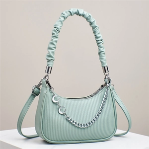 Pale green pleated crossbody bag with moon pendant and silver chain strap details