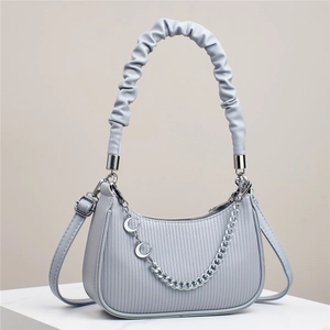 Elegant light blue-grey leather handbag for women featuring a moon chain and pleated handle