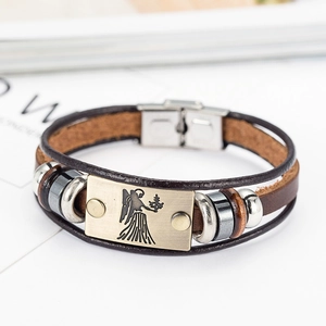 Detail of brown leather multi-layer bracelet with Virgo zodiac brass plaque and clasp