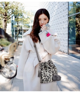 Leopard print plush bucket bag with chain strap and grey faux fur charm detail