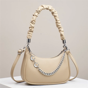 Elegant beige half-moon crossbody bag with vertical pleated texture and silver chain