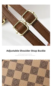 Detail of adjustable dark brown strap with gold buckle and checkered fabric pattern