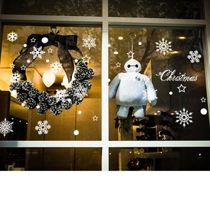 White Merry Christmas window decals with snowflakes and stars for holiday glass decoration