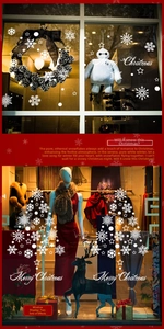 Detail showing white snowflake decals and Merry Christmas lettering on a glass window