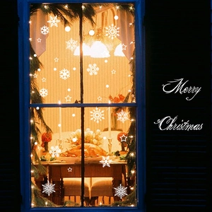 White snowflake window stickers with Merry Christmas text for festive holiday glass decor