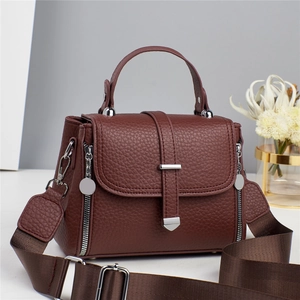 Elegant burgundy cross-body handbag for women featuring litchi texture and silver hardware