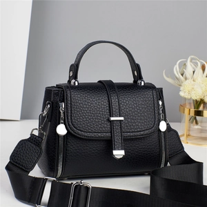 Elegant black lychee textured leather tote bag with silver hardware and wide shoulder strap