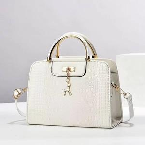 White crocodile pattern handbag for women with gold circular handles and deer pendant
