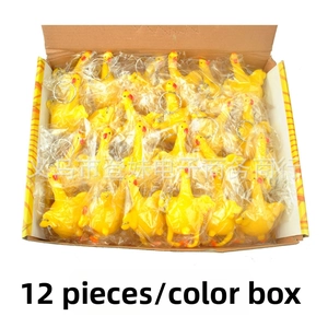 Detail of 12 rubber laying chicken keychains packed in a color box for stress relief
