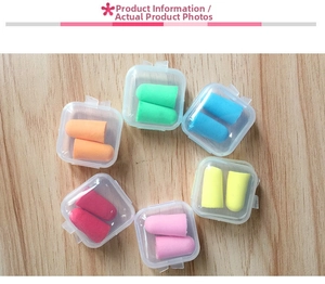 Colorful foam earplugs set with individual transparent storage cases on wood surface