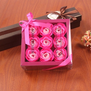 Detail of 9 pink gradient soap roses in a purple gift box with a pink ribbon bow