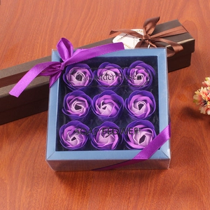 Detailed view of nine purple gradient soap flowers in an elegant gift box with ribbon