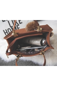 Internal view showing brown PU leather tote bag capacity with zipper and gold hardware