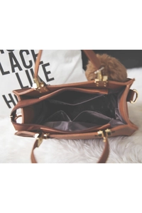 Internal structure of the brown frosted tote bag with zipper and plush pom-pom charm