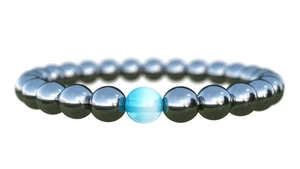 Minimalist gunmetal beaded bracelet featuring a luminous light blue opal stone center