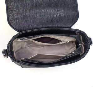 Interior view of black litchi pattern leather crossbody bag with silver hardware detail