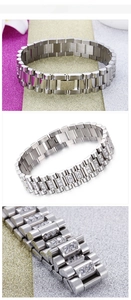 Macro view of men's stainless steel bracelet featuring triple row crystal pavé setting
