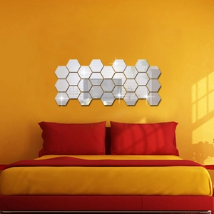 Detail of hexagon acrylic mirror wall stickers in a honeycomb layout on yellow walls
