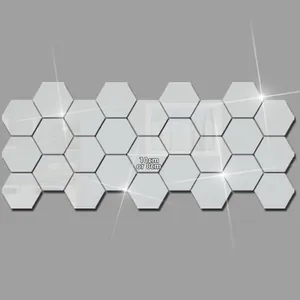 Close-up of hexagonal acrylic mirror wall stickers showing 10cm silver finish dimensions