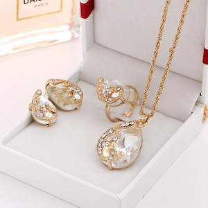 Detailed jewelry set with gold-plated crystal waterdrop necklace, earrings and ring in a box