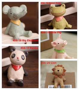 Close-up of mini resin animal figurines with matte texture and colorful neckties