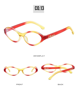 Detail view of retro cat eye sunglasses with red-yellow gradient frame and gold logo