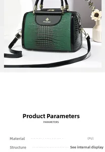 Detail der grünen PU-Handtasche mit Krokostruktur, goldenem Logo und schwarzem Besatz