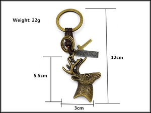 Detail view of bronze elk keychain with leather strap and engraved tag showing dimensions