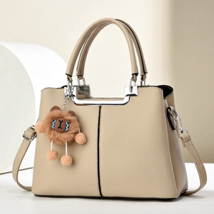 Elegant beige lychee texture leather handbag with silver handle and bear pendant