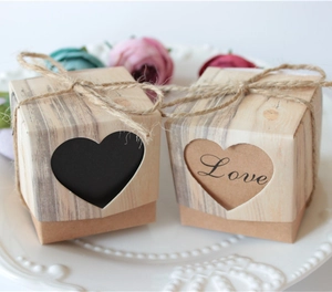 European kraft paper wedding candy boxes with heart cut-outs and rustic twine bows