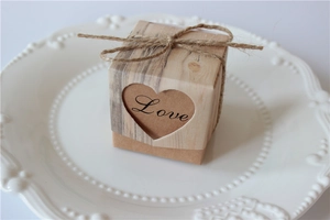 Detail of kraft paper gift box with wood grain pattern, heart cutout and hemp rope