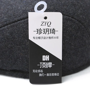 Deep grey winter wool newsboy cap with ear protection and textured thick fabric