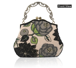 Detailed view of vintage bead embroidery and floral patterns on retro linen handbag